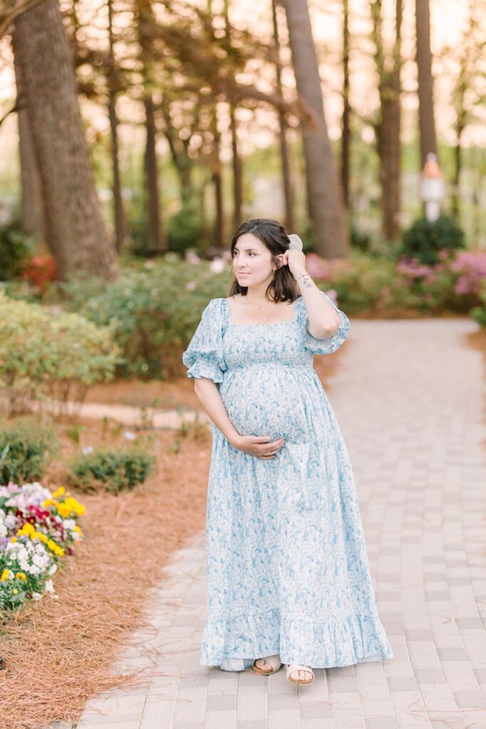 Flowing blue floral gown demonstrating what to wear to a maternity photoshoot during a Raleigh NC maternity session by Lindsey Lambert Photography.
