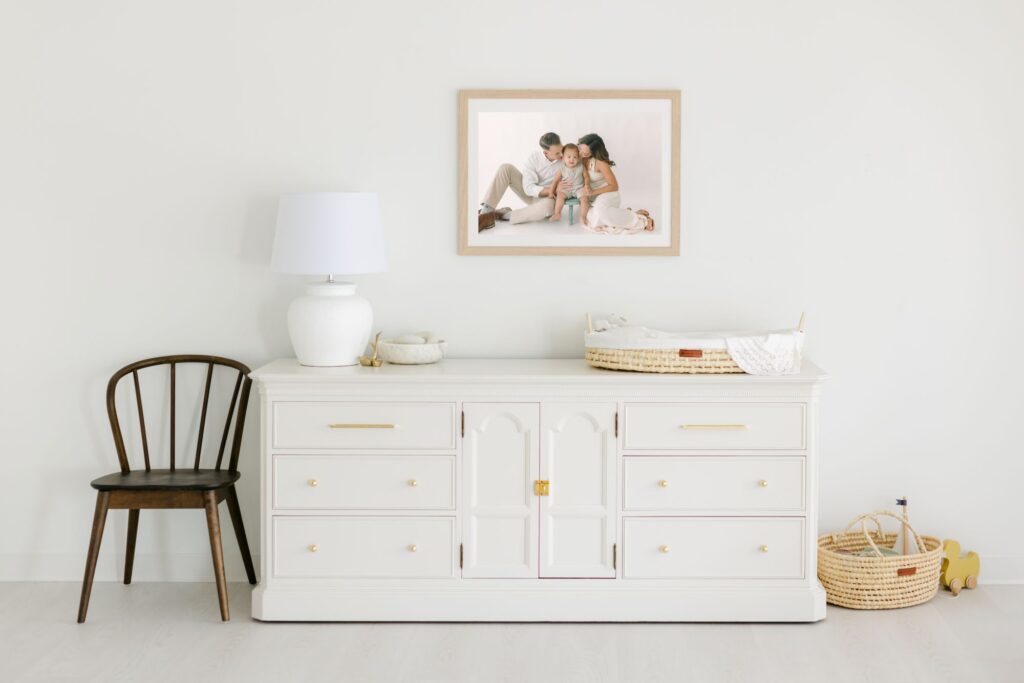 Nursery photo gallery wall ideas with framed family artwork creating a meaningful focal point above a dresser by Lindsey Lambert Photography.