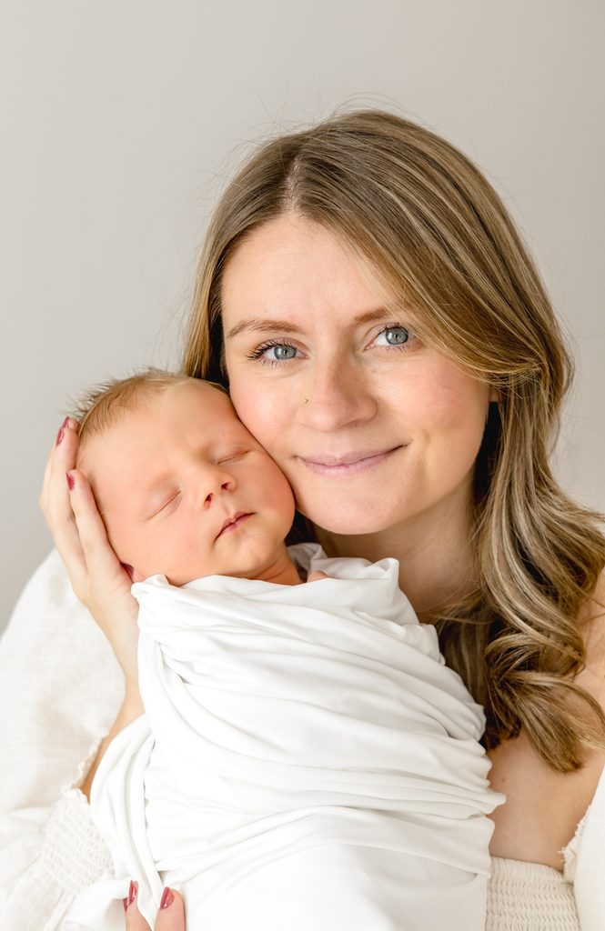 Mother holding her sleeping newborn baby photographed by Lindsey Lambert Photography, a Raleigh maternity and newborn photographer.